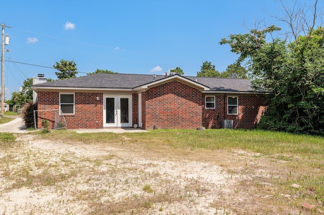 4221 Cap Chat St, Hephzibah, GA 30815 - rear view of property with french doors, brick siding, and a chimney