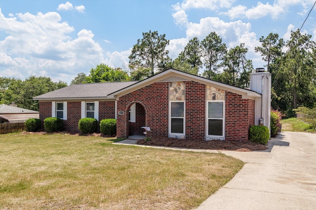 4221 Cap Chat St, Hephzibah, GA 30815 - view of front of house featuring a chimney, brick siding, and driveway
