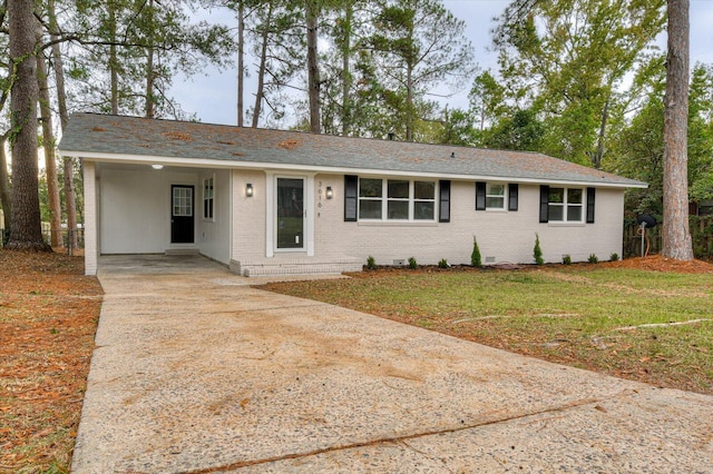 ranch-style home with a carport and a front lawn