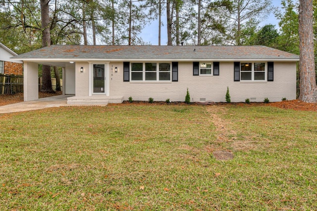 ranch-style home featuring a front yard and a carport