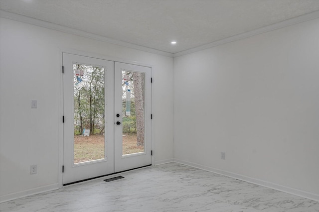 doorway featuring french doors and crown molding