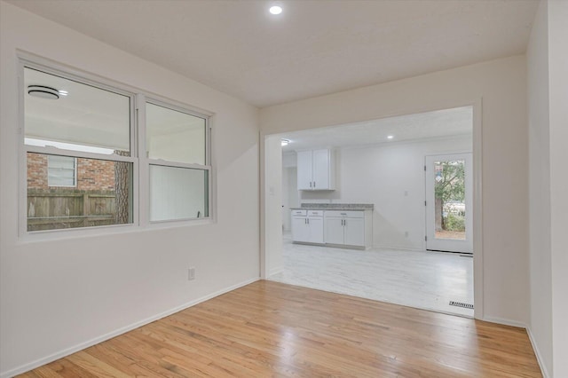 unfurnished living room with light hardwood / wood-style floors