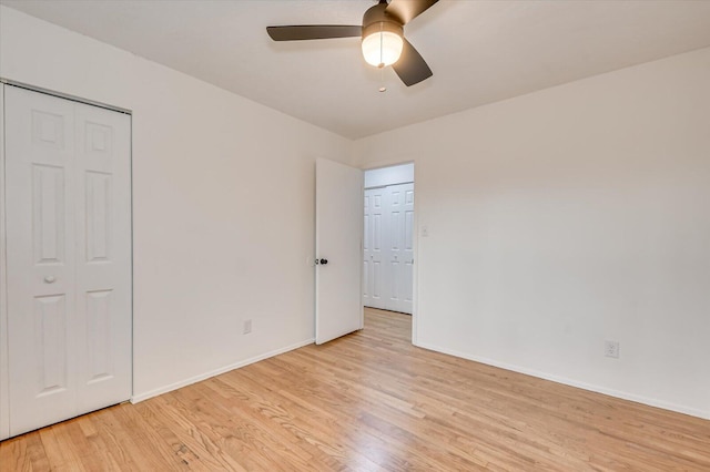 unfurnished bedroom featuring light wood-type flooring and ceiling fan