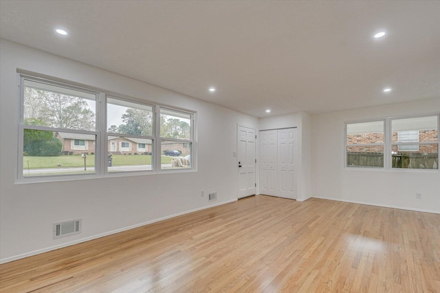 spare room with light hardwood / wood-style floors