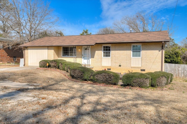 ranch-style house featuring brick siding, crawl space, and fence