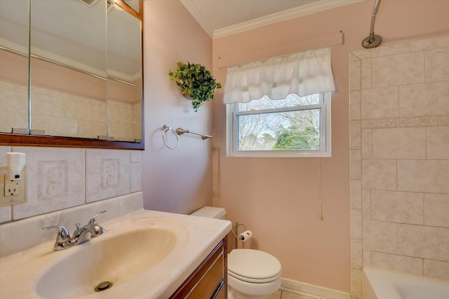 full bath featuring baseboards, toilet, crown molding, vanity, and shower / washtub combination