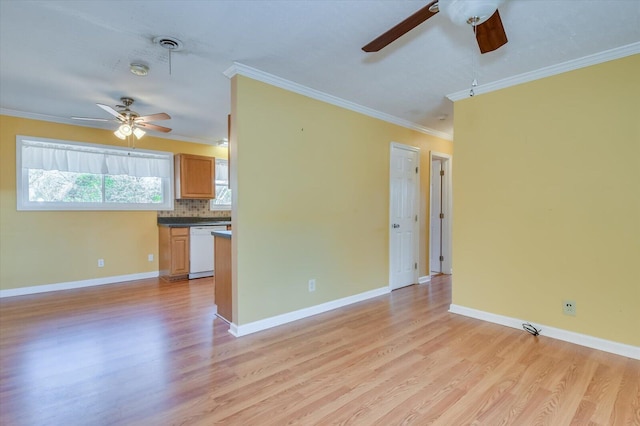 unfurnished living room with light wood-style flooring, ornamental molding, and baseboards