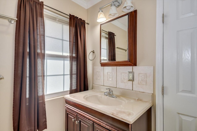 bathroom with crown molding and vanity