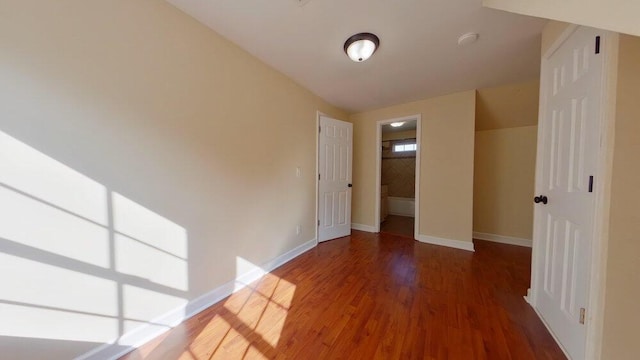 unfurnished room featuring hardwood / wood-style flooring