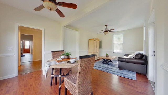 dining area featuring ceiling fan and hardwood / wood-style floors