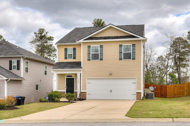 view of front of property featuring central AC unit, a garage, and a front lawn