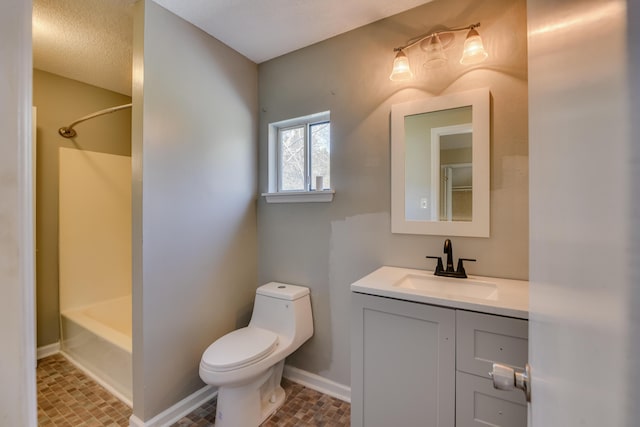 bathroom featuring  shower combination, vanity, toilet, and baseboards