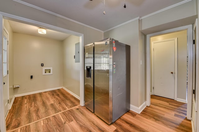 hallway featuring crown molding, baseboards, and wood finished floors