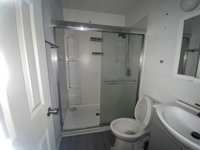 3415 Cauthen Dr, Augusta, GA 30906 - full bath with a shower stall, toilet, vanity, and wood finished floors