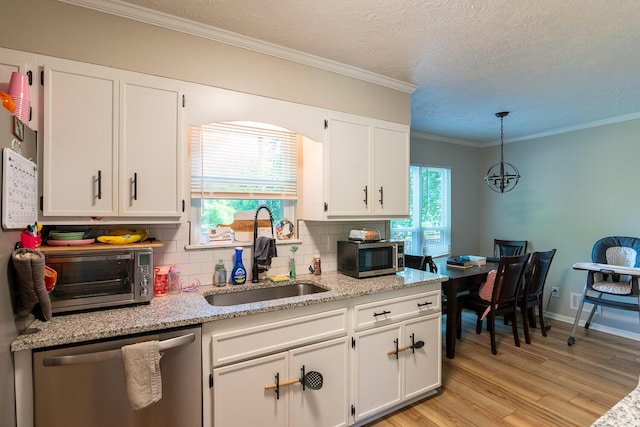 4387 Quail Creek Rd, Martinez, GA 30907 - kitchen with appliances with stainless steel finishes, a sink, decorative backsplash, light wood-style floors, and white cabinetry