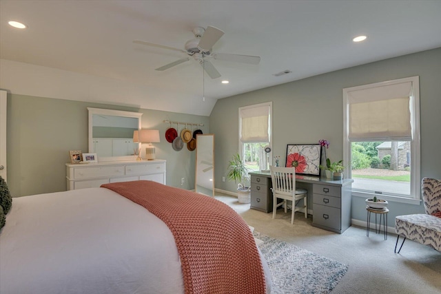 bedroom with ceiling fan, light colored carpet, and lofted ceiling