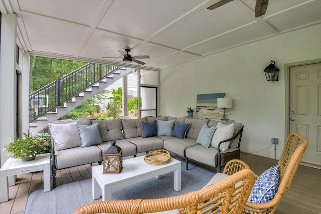 exterior space with hardwood / wood-style flooring, expansive windows, a healthy amount of sunlight, and coffered ceiling