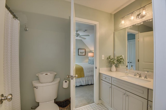 bathroom featuring ceiling fan, toilet, and vanity