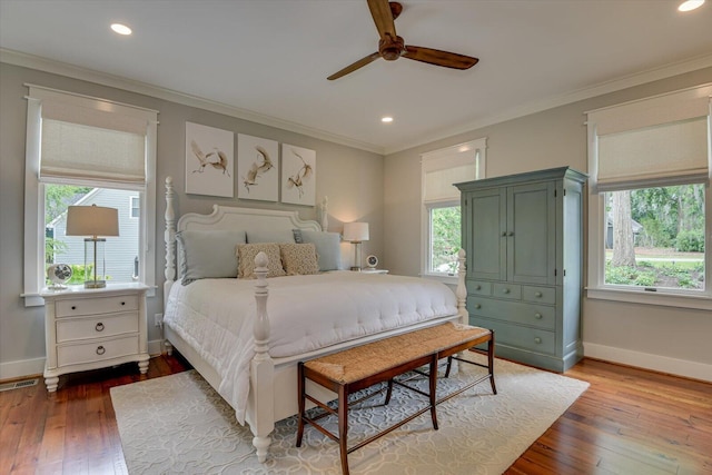 bedroom with ceiling fan, light hardwood / wood-style floors, and ornamental molding