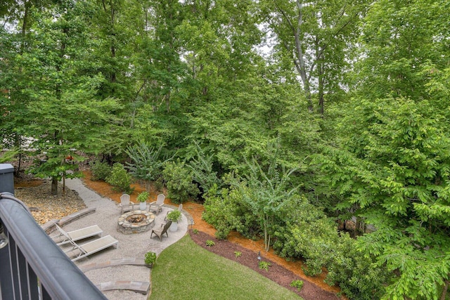 view of yard with an outdoor fire pit and a patio area