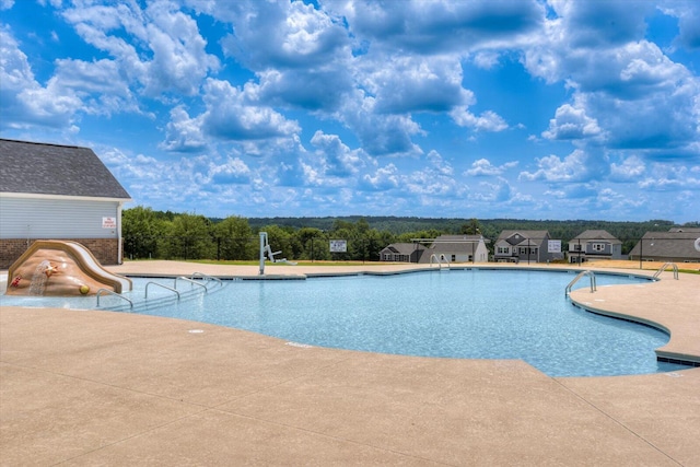 view of swimming pool featuring a patio area