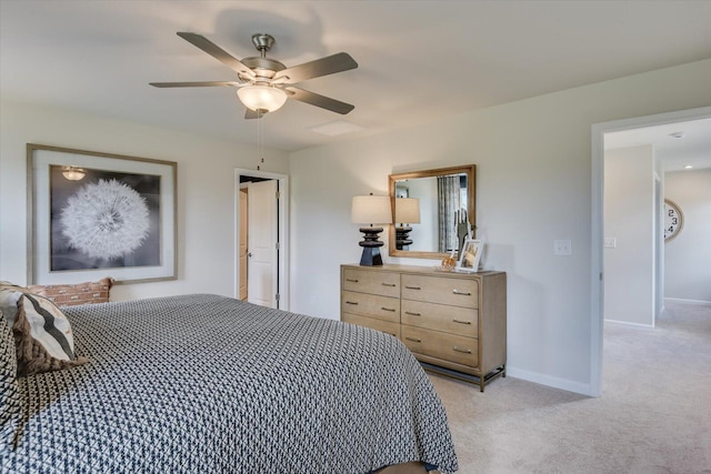 bedroom featuring ceiling fan and light carpet