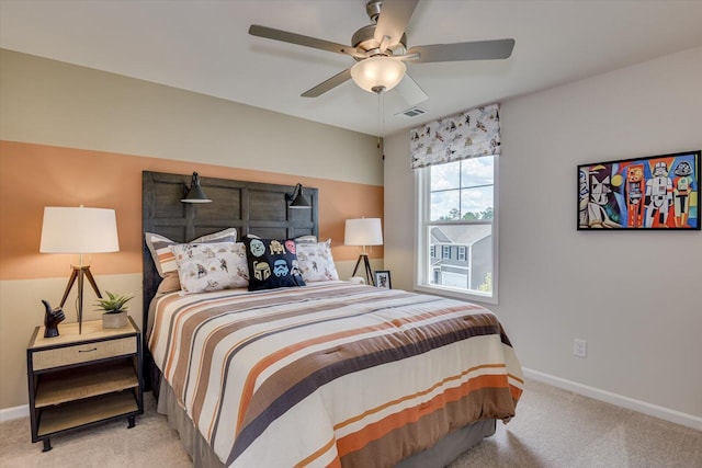 bedroom featuring ceiling fan and light carpet