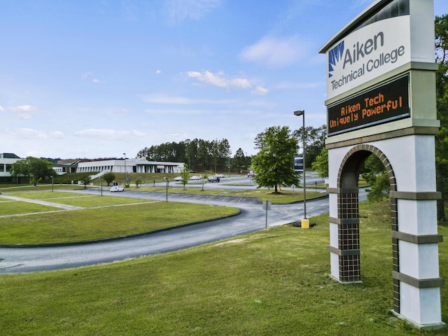 view of property's community with a yard