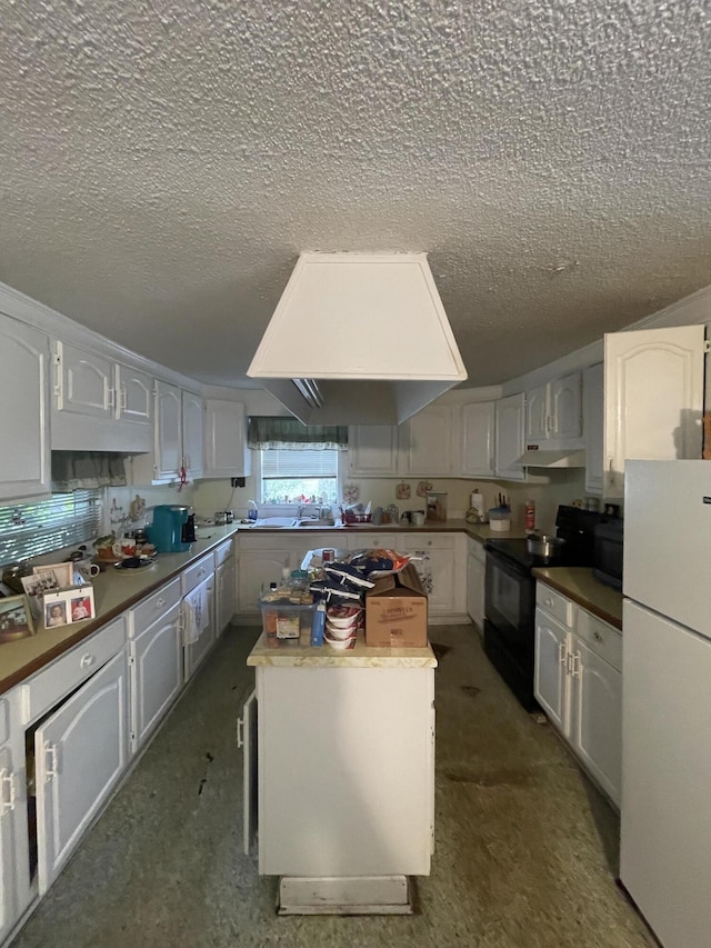 kitchen featuring black electric range, white cabinets, and white refrigerator