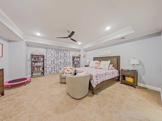 bedroom featuring carpet, ceiling fan, a raised ceiling, and crown molding