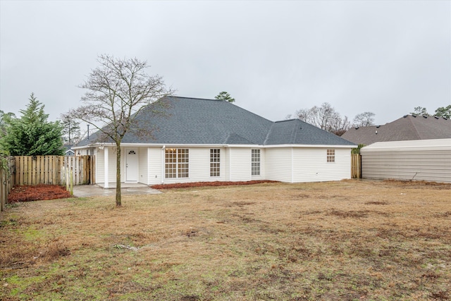 back of house with a yard