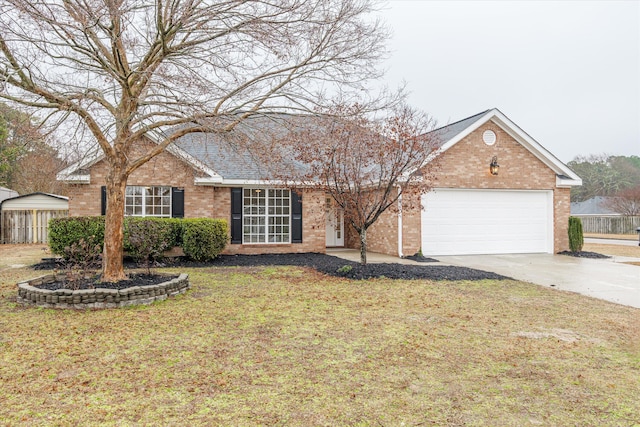 single story home featuring a garage and a front lawn