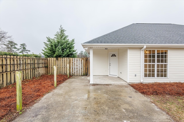 property entrance featuring a patio area