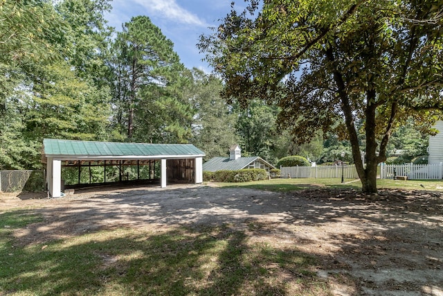 view of home's community featuring an outdoor structure