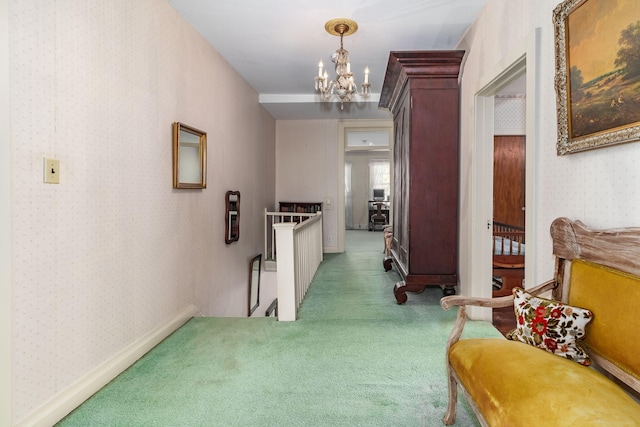 hallway featuring dark colored carpet and an inviting chandelier