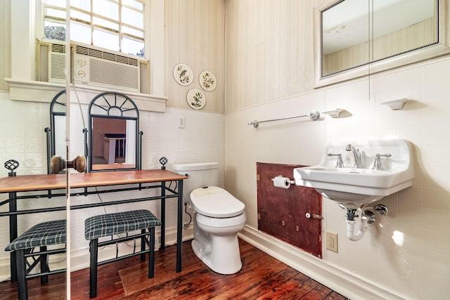 bathroom featuring hardwood / wood-style floors and toilet