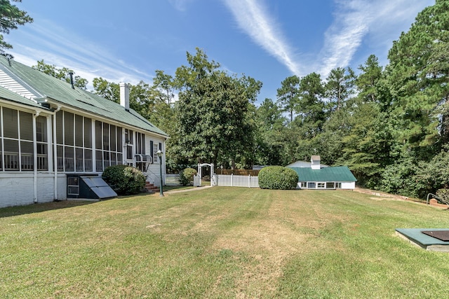 view of yard featuring a sunroom