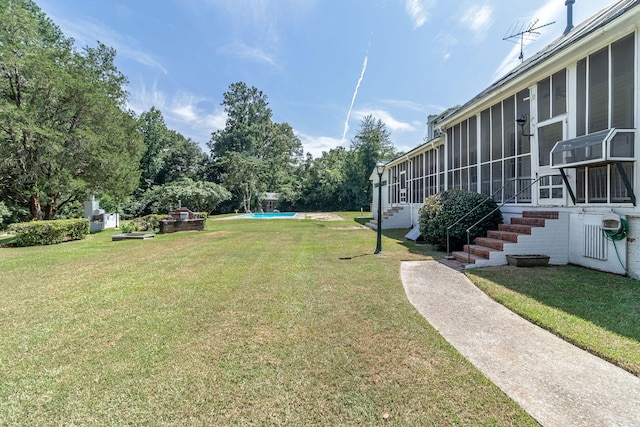 view of yard featuring a sunroom