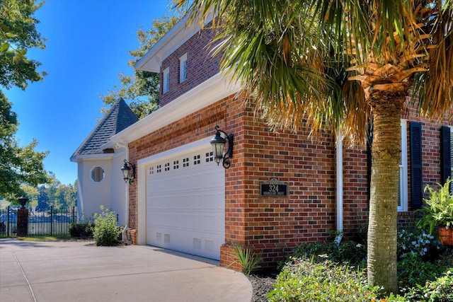 324 E Shoreline Dr, North Augusta, SC 29841 - view of property exterior featuring concrete driveway, brick siding, and a shingled roof