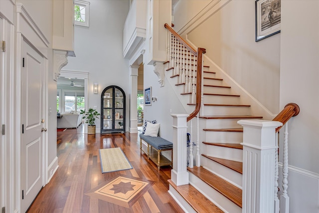 324 E Shoreline Dr, North Augusta, SC 29841 - entryway with healthy amount of natural light, wood finished floors, stairway, a towering ceiling, and baseboards