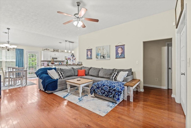 752 Keyes Dr, Grovetown, GA 30813 - living room with a chandelier, wood-type flooring, ceiling fan, a textured ceiling, and baseboards