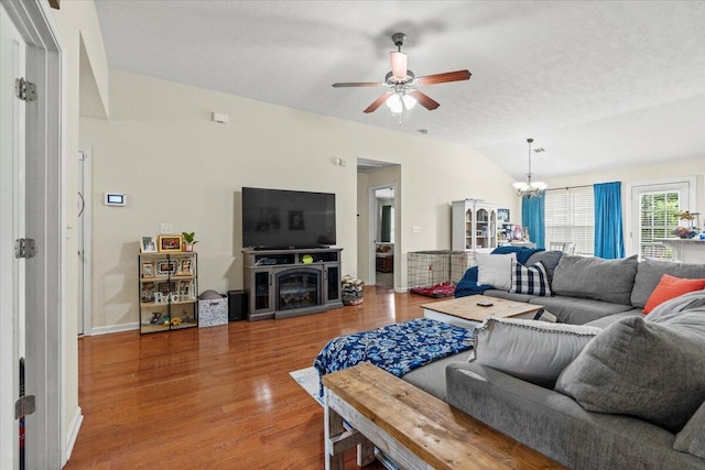 752 Keyes Dr, Grovetown, GA 30813 - living area with vaulted ceiling, a chandelier, ceiling fan, wood finished floors, and a textured ceiling
