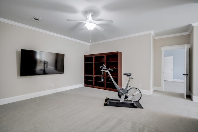workout area featuring ceiling fan, ornamental molding, baseboards, and carpet