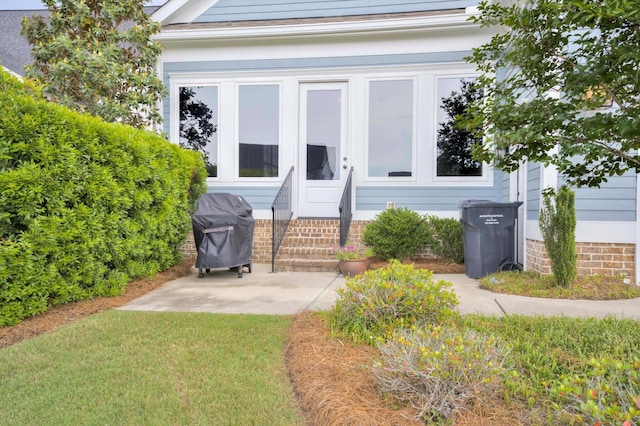 property entrance with a patio