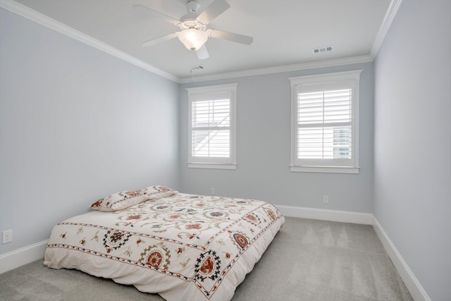 bedroom with light colored carpet, visible vents, and multiple windows
