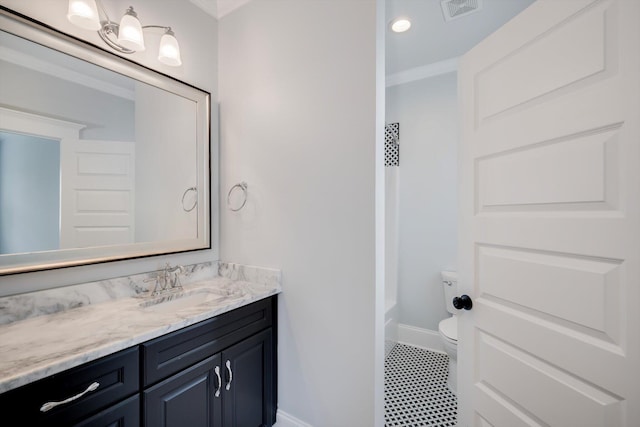 bathroom featuring vanity, toilet, tile patterned floors, baseboards, and visible vents