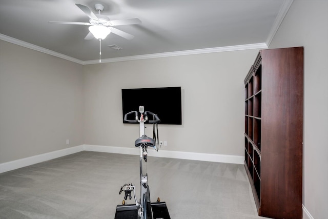 workout area featuring carpet floors, ornamental molding, and a ceiling fan