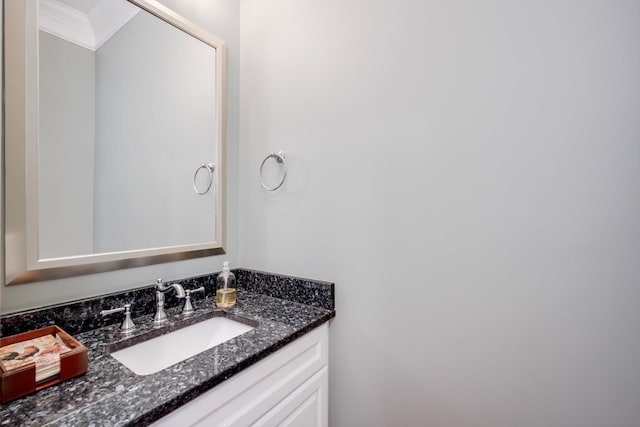 bathroom featuring crown molding and vanity