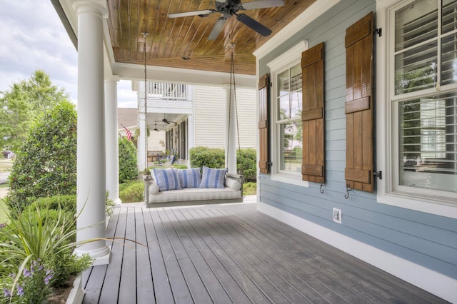 deck featuring a ceiling fan and covered porch