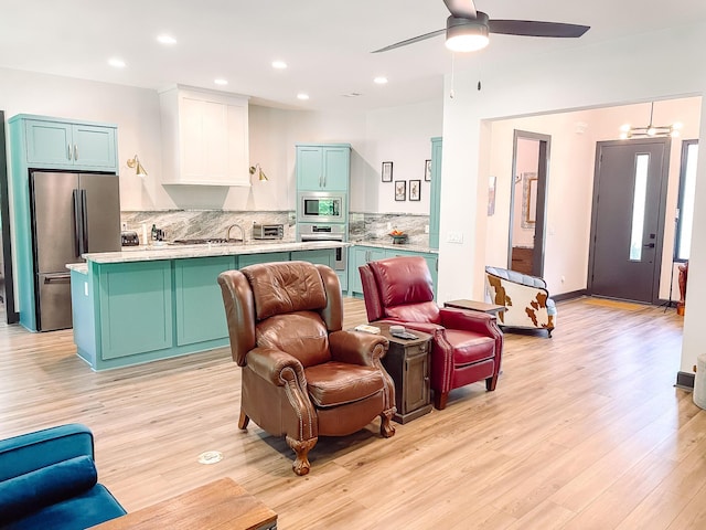 217 Cove Point Ln, Mccormick, SC 29835 - living room with light wood-style floors, a ceiling fan, and recessed lighting
